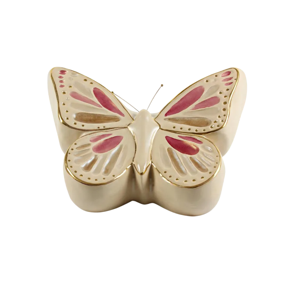farfalle-Photoroom Mariposa decorativa de cerámica con detalles en color dorado y tonos rosados, ideal para adornar espacios y como regalo.